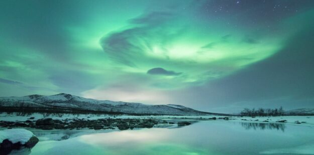 Celebrate Beneath the Aurora in Arctic Norway and Finland | Travel with Aurora Nights